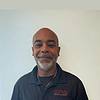 man wearing dark polo shirt