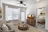 Modern living room with a cozy sofa, wooden coffee table, and large window letting in natural light.