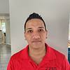 man with red shirt and spiked hair