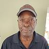 man wearing baseball cap and black shirt