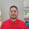 man wearing red polo shirt