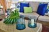 Vases on coffee table with plant and candle