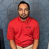 man wearing red polo shirt