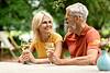 Couple sitting at table with wine glasses