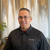 man with polo shirt and glasses