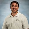 smiling man in polo shirt