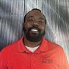 man wearing red polo shirt and white undershirt