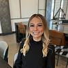 woman with black blouse and blonde hair