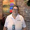 woman wearing shirt with nametag