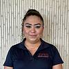 woman with earrings and polo shirt