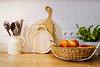 countertop with basket and cutting boards
