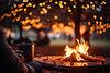 Person sitting next to fire pit