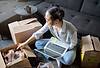 Woman unpacking boxes