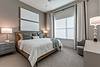 Bedroom with bed, side tables, and lamps
