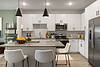 Kitchen island with seating and pendant lighting