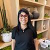 woman with straight black hair and black shirt