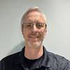 man with glasses and short beard