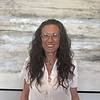 woman wearing a white shirt asnd glasses
