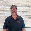   man wearing baseball cap and navy blue shirt