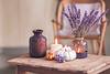 Pumpkins, lavender, and candles on table