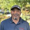 man wearing blue polo shirt