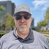 man wearing sunglasses and baseball cap