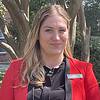 woman wearing black shirt and red jacket