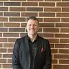 man wearing black shirt and suit coat