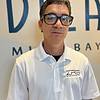 man with white shirt and black rimmed glasses
