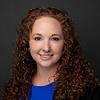 smiling woman with curly hair