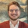 Smiling Man with short beard and glasses