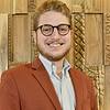 Smiling Man with short beard and glasses