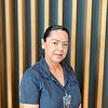 smiling woman in polo shirt