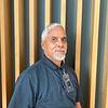 man with goatee and polo shirt