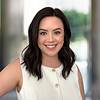 smiling woman leaning forward