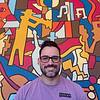 man wearing purple shirt