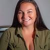 Women in green shirt smiling