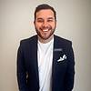 smiling man with short hair and short beard