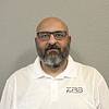man with beard, glasses, and polo shirt