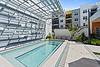 A modern outdoor pool area with lounge chairs and stylish architectural elements.