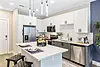Modern kitchen with sleek appliances and stylish decor.