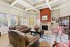 Spacious living room with elegant furnishings and a cozy fireplace.
