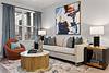 living room with art, sofa, and stylish decor