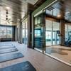 yoga room with view of fitness center