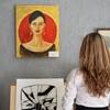 Woman viewing art in gallery
